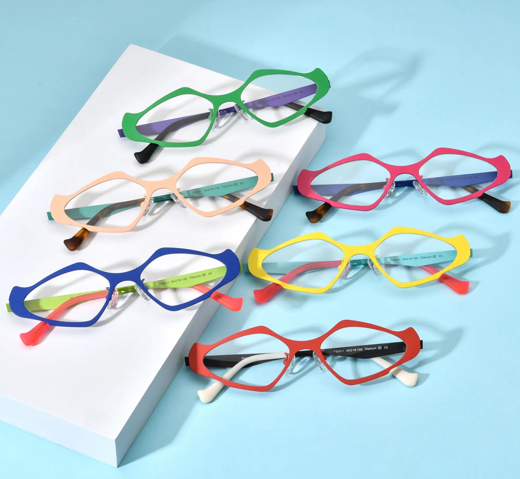 VoyueLens™ VL185811 eyeglasses – full collection of six geometric titanium frames in vibrant dual-tone color variants displayed in flat lay